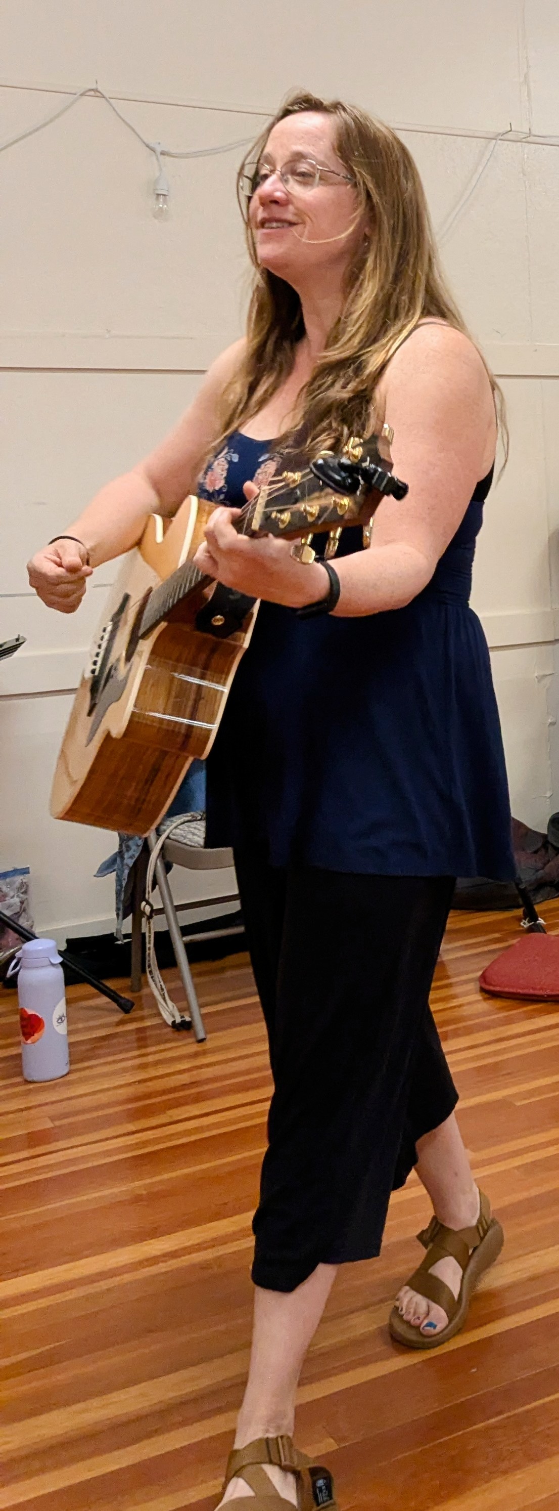 Katie Sontag Playing the Guitar.