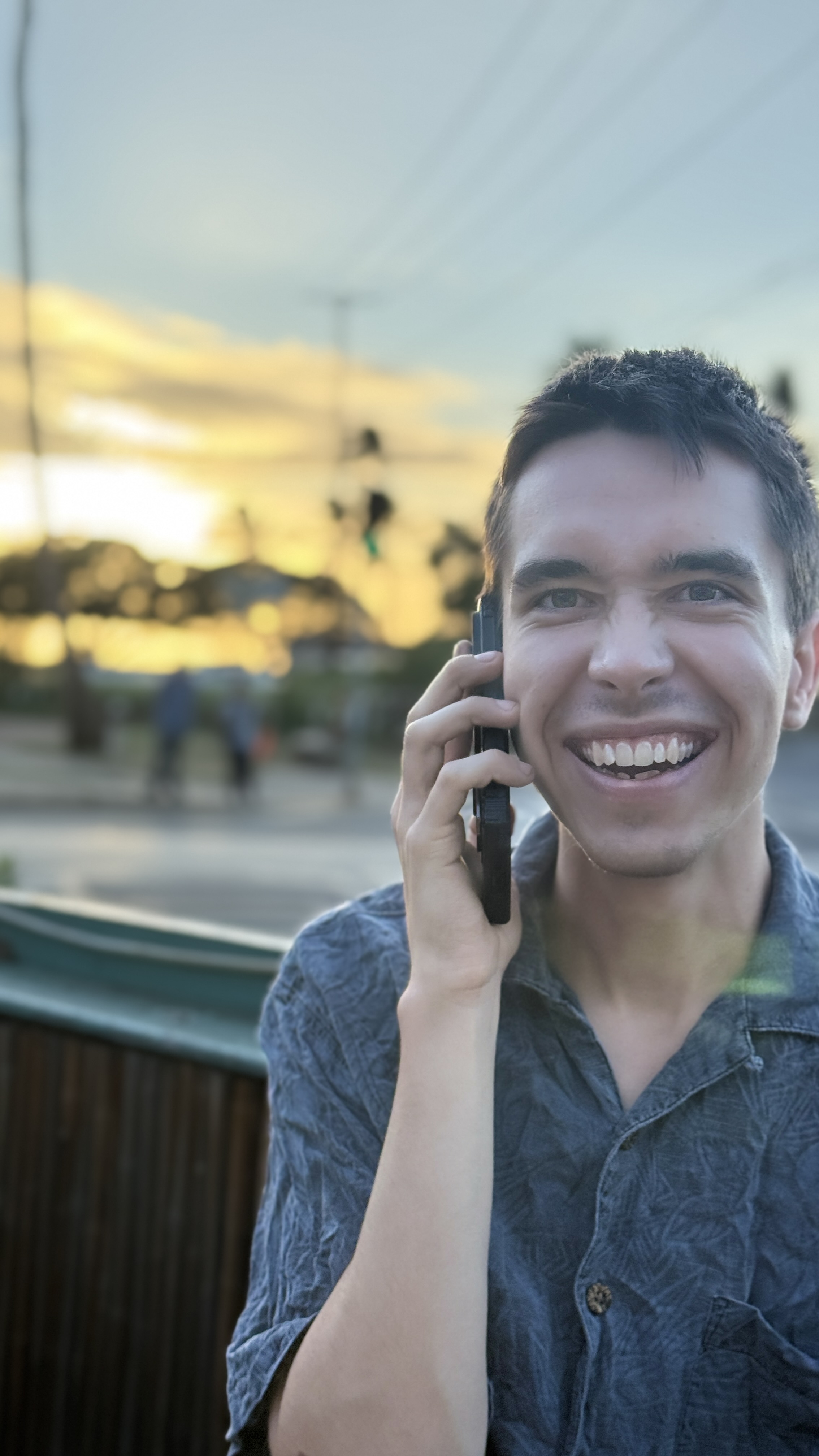 A picture of Miles Ward taking a phone call.